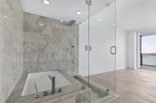 a view of a patio with chairs and a table