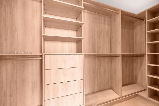 a view of small yard with wooden fence