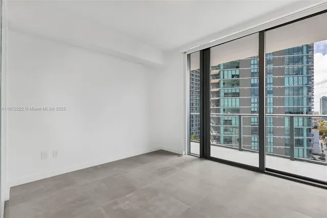 a view of an empty room with a balcony