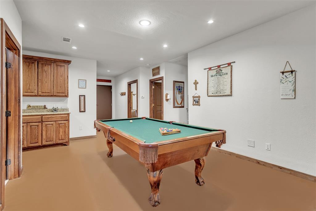 13831 Friendship Road Pilot Point, TX 76258 - Photo 13 of 31 a room with table chairs and stainless steel appliances