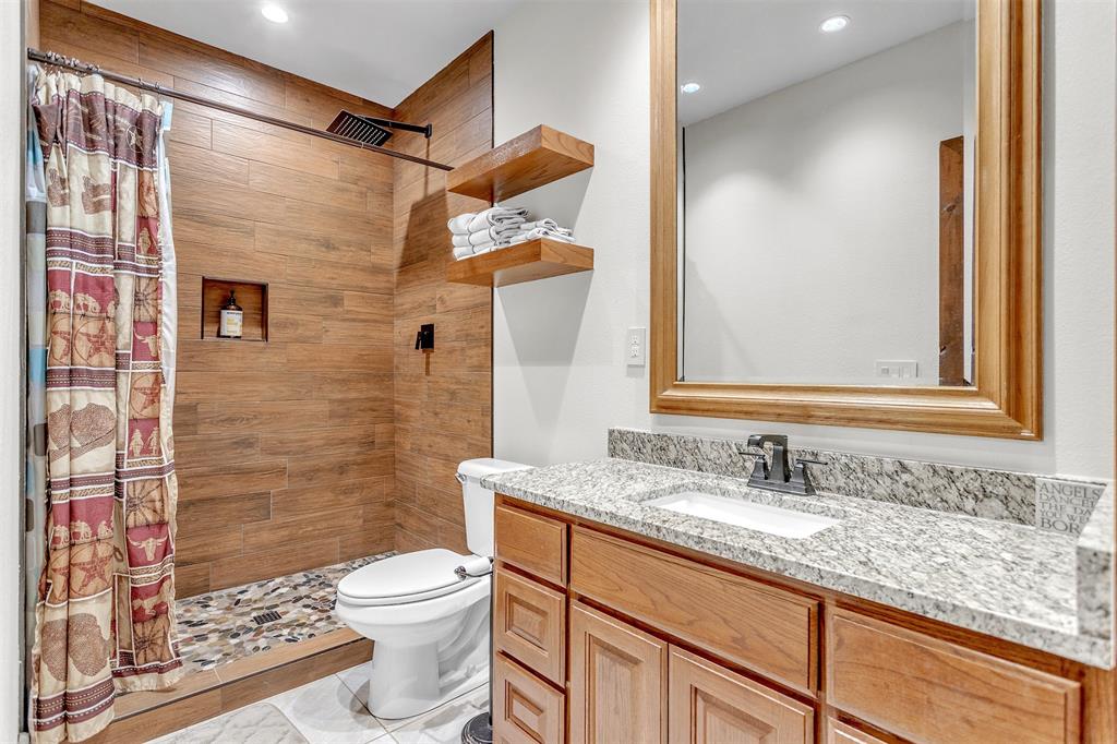 13831 Friendship Road Pilot Point, TX 76258 - Photo 16 of 31 Bathroom with vanity, a tile shower, and recessed lighting