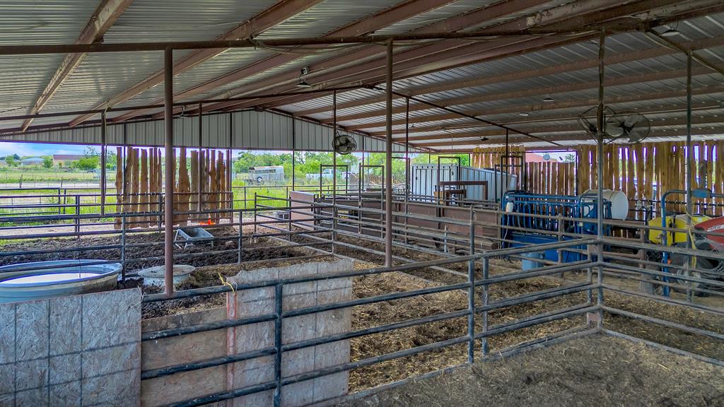 13831 Friendship Road Pilot Point, TX 76258 - Photo 24 of 31 View of covered barn with pens with fans, tack room water and electricity