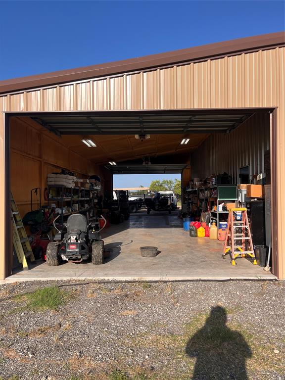 13831 Friendship Road Pilot Point, TX 76258 - Photo 27 of 31 a view of parking garage with cars