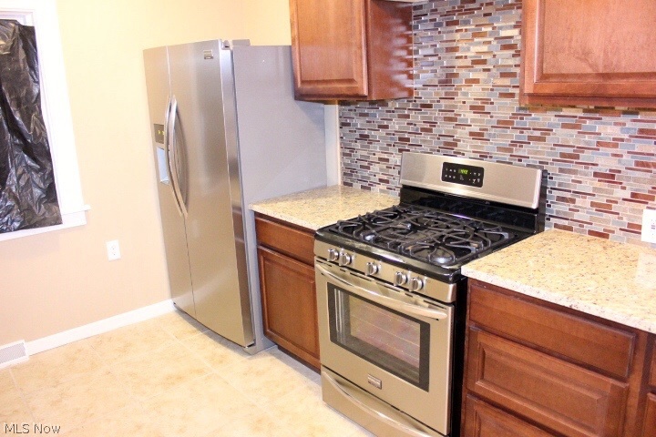 3038 Becket Road Cleveland, OH 44120 - Photo 6 of 14 Enjoy this beautiful Kitchen with new stainless steel appliances with backsplash brand new wood cabinets throughout