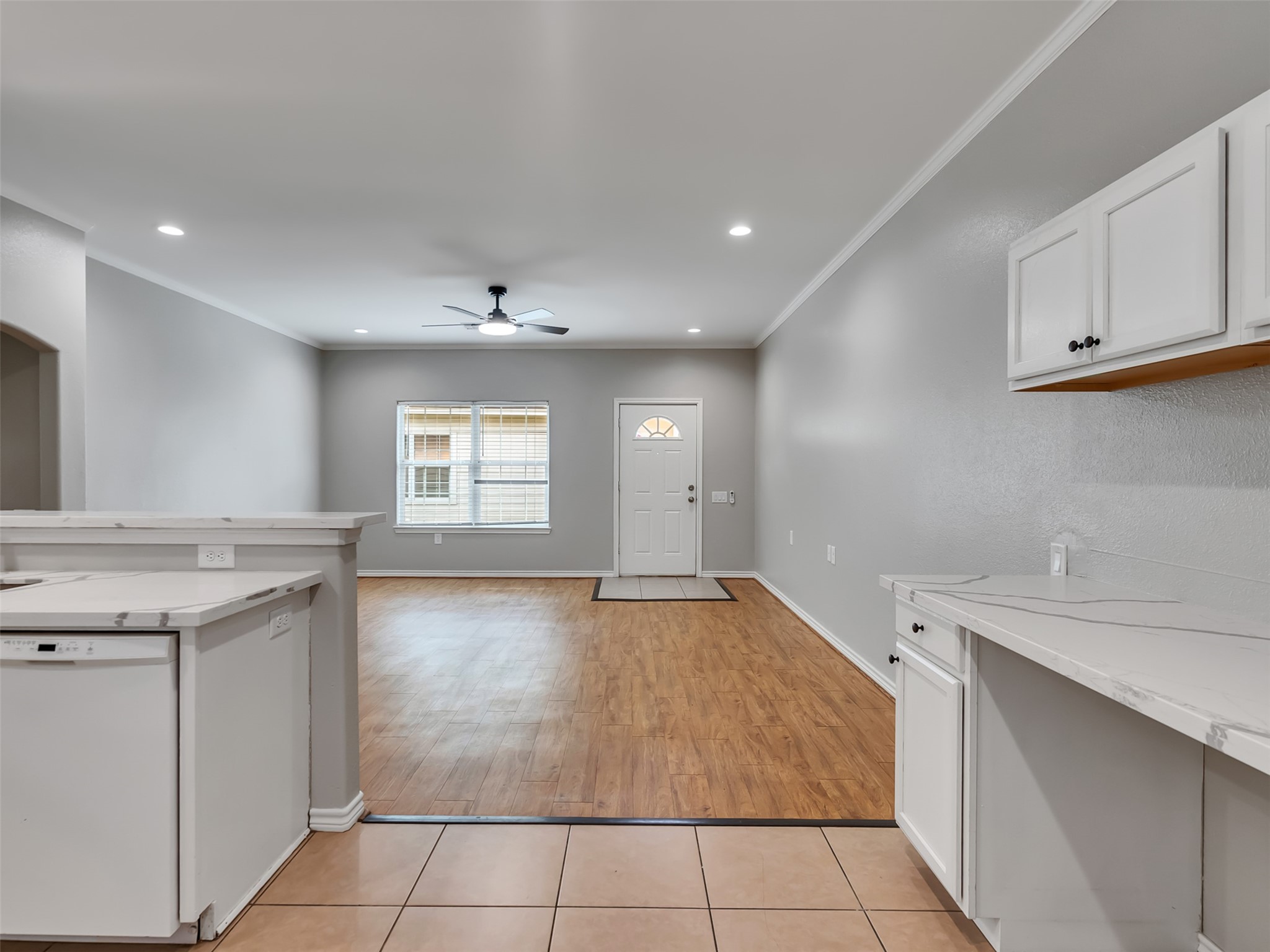 104 Longstreet Road, Unit 2 Willis, TX 77378 - Photo 14 of 26 a view of a kitchen with a sink and dishwasher with wooden floor