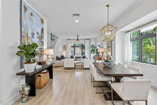 a view of a dining room with furniture window and outside view