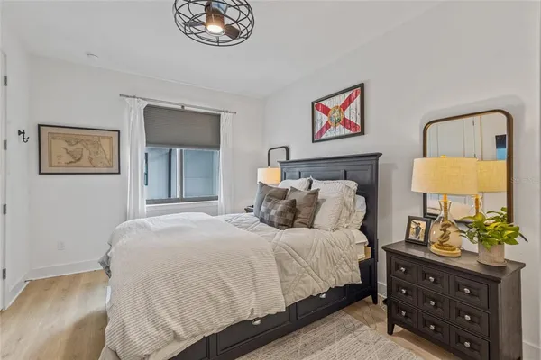 a bedroom with a bed and a dresser