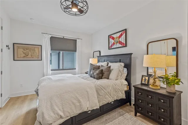 a bedroom with a bed and a dresser