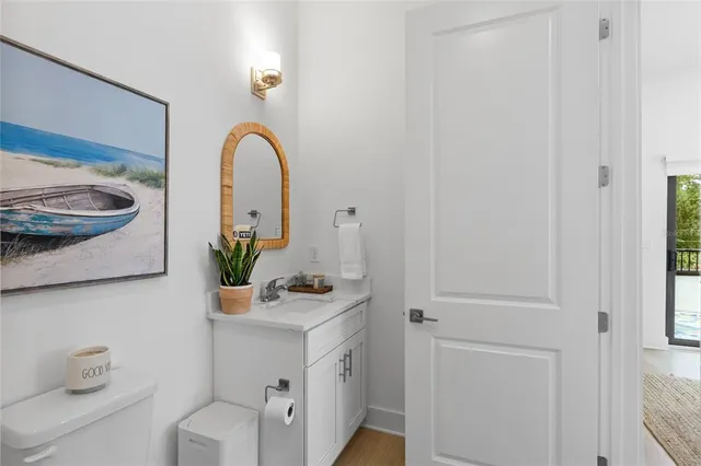 a room with a sink and a mirror