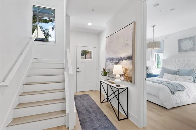 a view of a livingroom with furniture and staircase