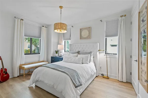 a bedroom with a bed and window