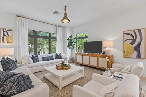 a living room with furniture and a flat screen tv