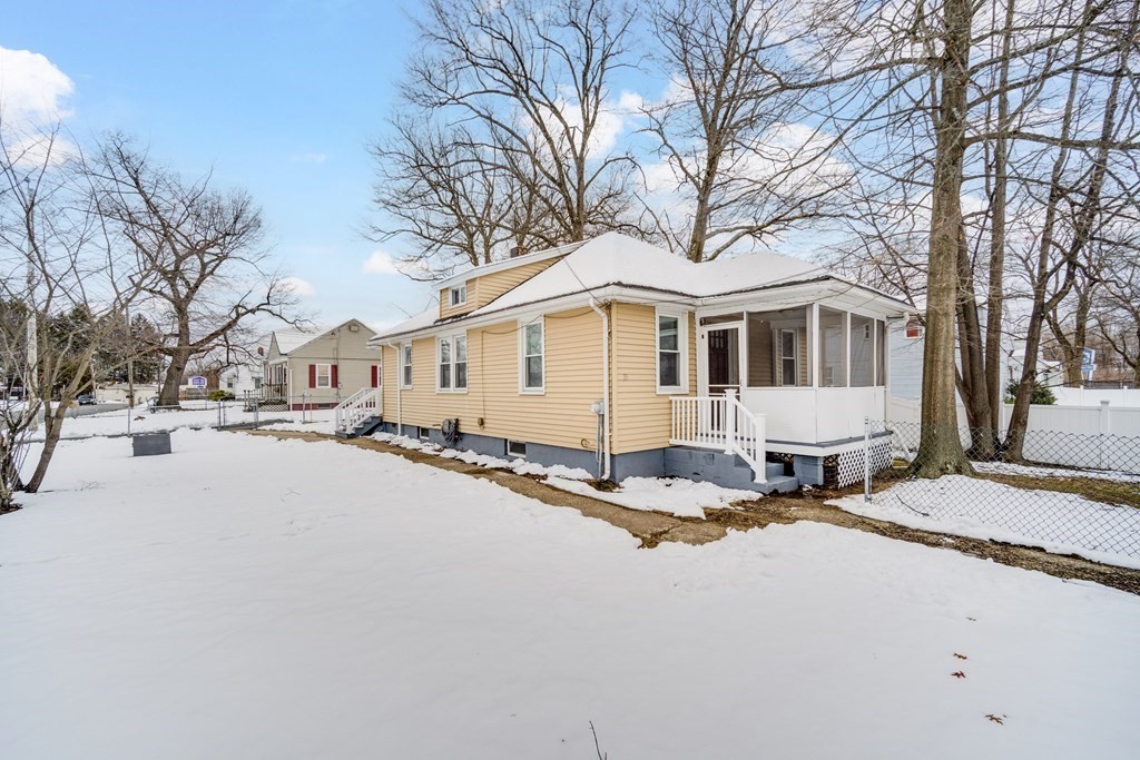35 Stuart Street Springfield, MA 01119 - Photo 1 of 34 a street view with a house covered in snow