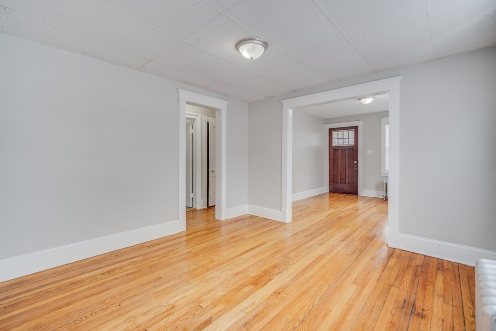 35 Stuart Street Springfield, MA 01119 - Photo 12 of 34 a view of an empty room and wooden floor