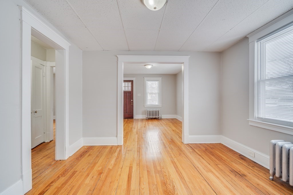 35 Stuart Street Springfield, MA 01119 - Photo 13 of 34 a view of a room with wooden floor and staircase