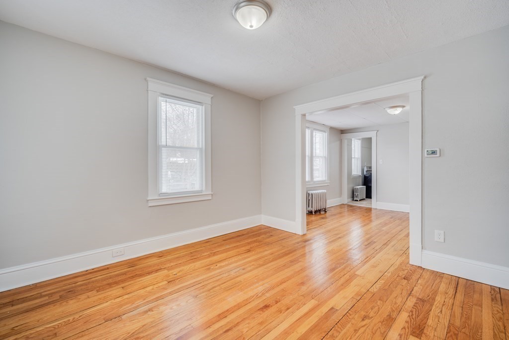 35 Stuart Street Springfield, MA 01119 - Photo 16 of 34 a view of empty room with wooden floor and fan