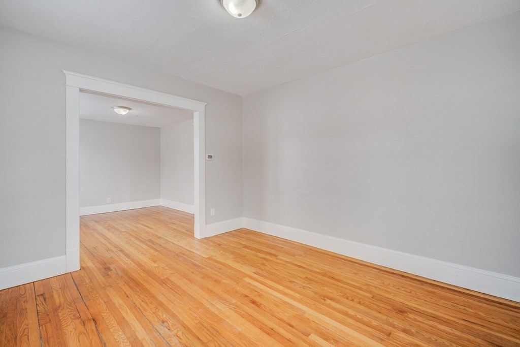 35 Stuart Street Springfield, MA 01119 - Photo 18 of 34 a view of empty room with wooden floor