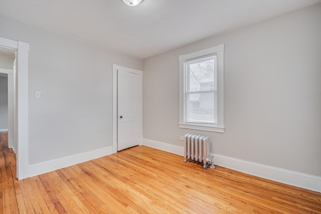 35 Stuart Street Springfield, MA 01119 - Photo 26 of 34 a view of empty room with wooden floor and fan