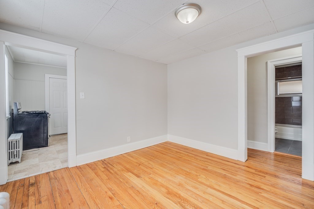 35 Stuart Street Springfield, MA 01119 - Photo 29 of 34 a view of empty room with wooden floor
