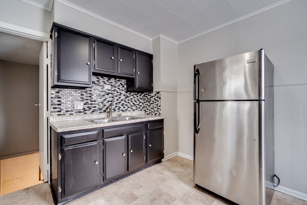 35 Stuart Street Springfield, MA 01119 - Photo 7 of 34 a kitchen with stainless steel appliances granite countertop a refrigerator and a sink