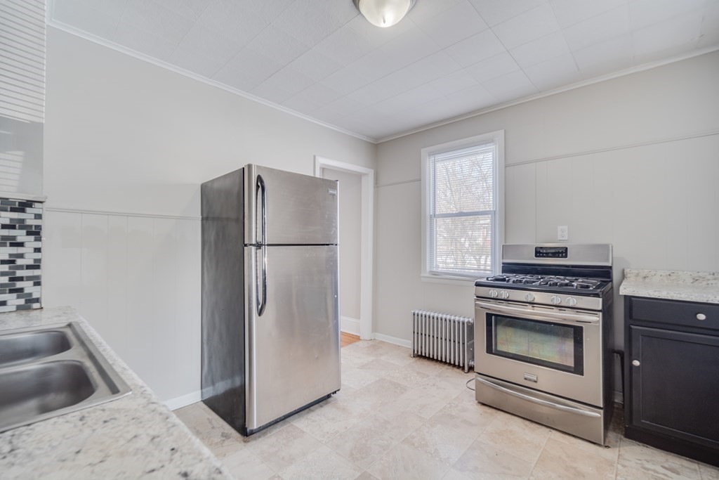 35 Stuart Street Springfield, MA 01119 - Photo 8 of 34 a kitchen with a refrigerator sink and stove