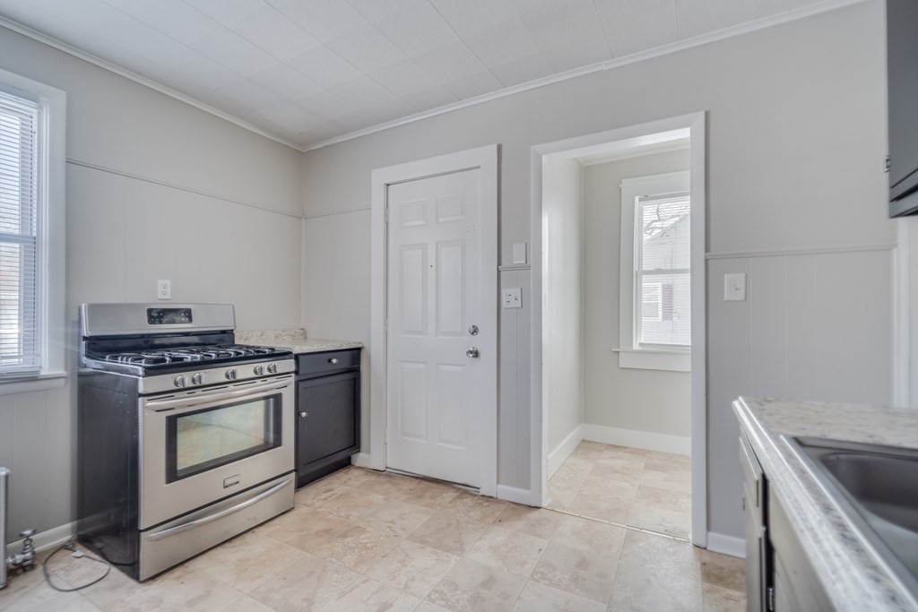 35 Stuart Street Springfield, MA 01119 - Photo 9 of 34 a kitchen with a stove and a sink