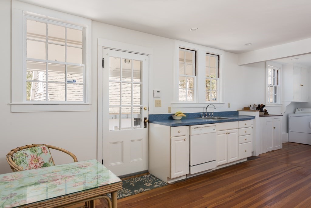 16 Jefferson Shores Road Wareham, MA 02532 - Photo 11 of 28 a spacious bathroom with a granite countertop sink and a mirror