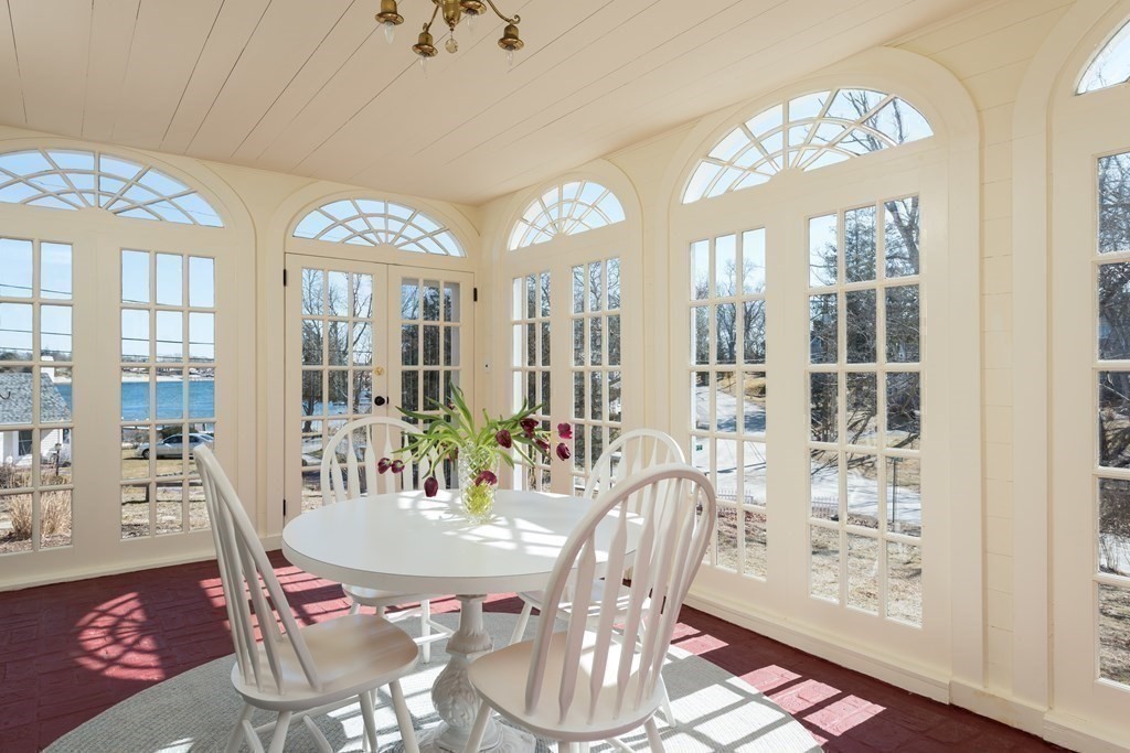 16 Jefferson Shores Road Wareham, MA 02532 - Photo 5 of 28 a view of a dining room with furniture wooden floor and chandelier