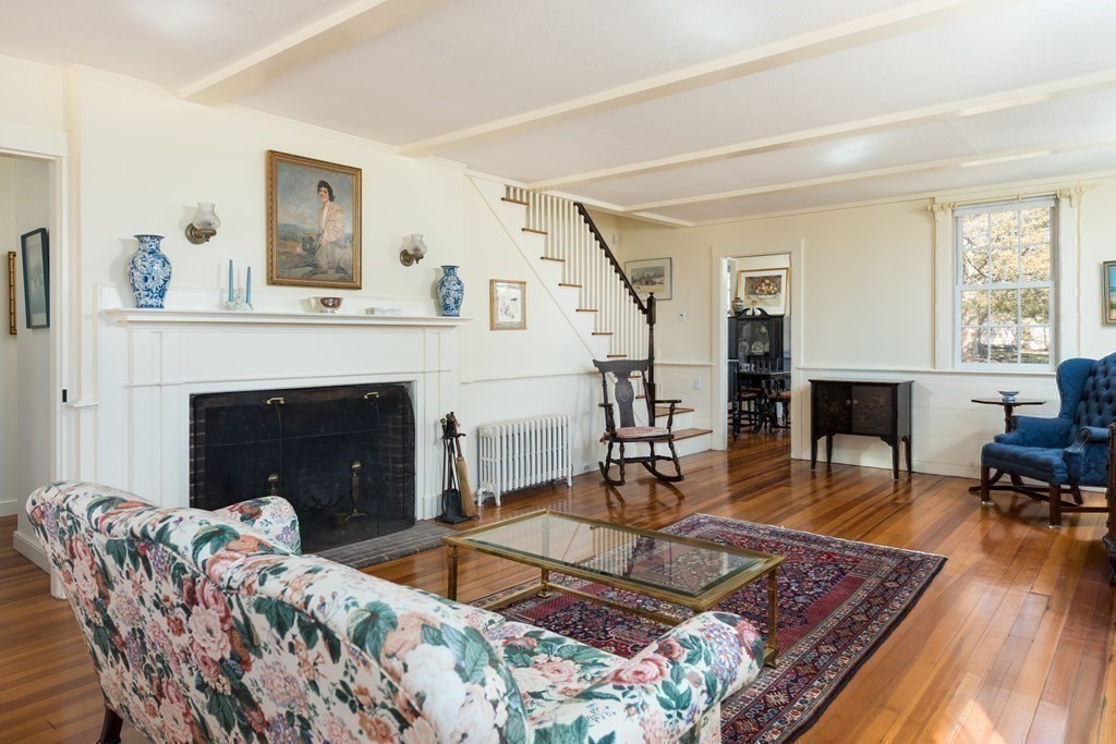 16 Jefferson Shores Road Wareham, MA 02532 - Photo 6 of 28 a living room with furniture and a fireplace