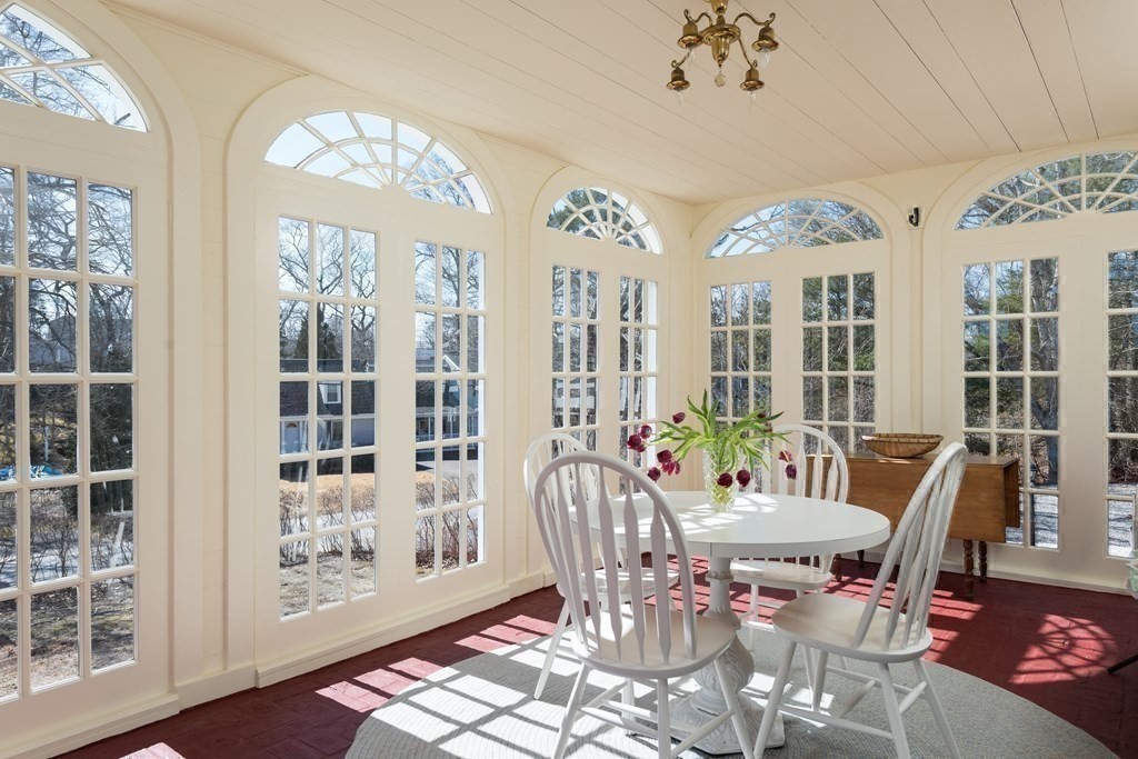 16 Jefferson Shores Road Wareham, MA 02532 - Photo 7 of 28 a view of a dining room with furniture wooden floor and chandelier
