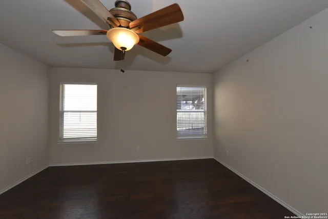 a light in a room next to a window