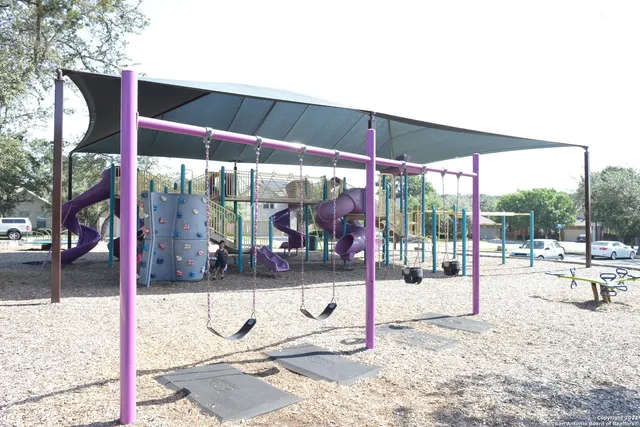 a view of a swimming pool with a patio