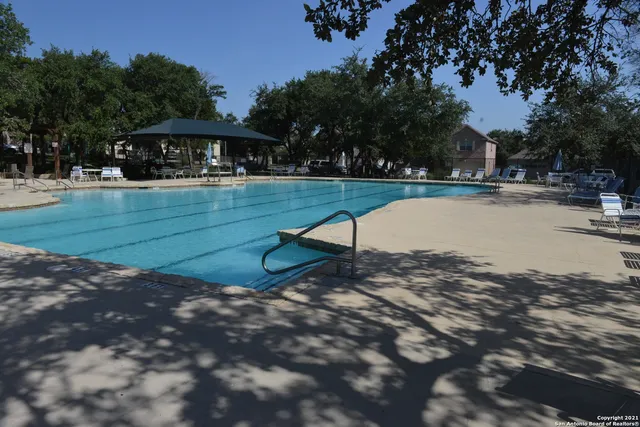 a view of backyard of house with green space