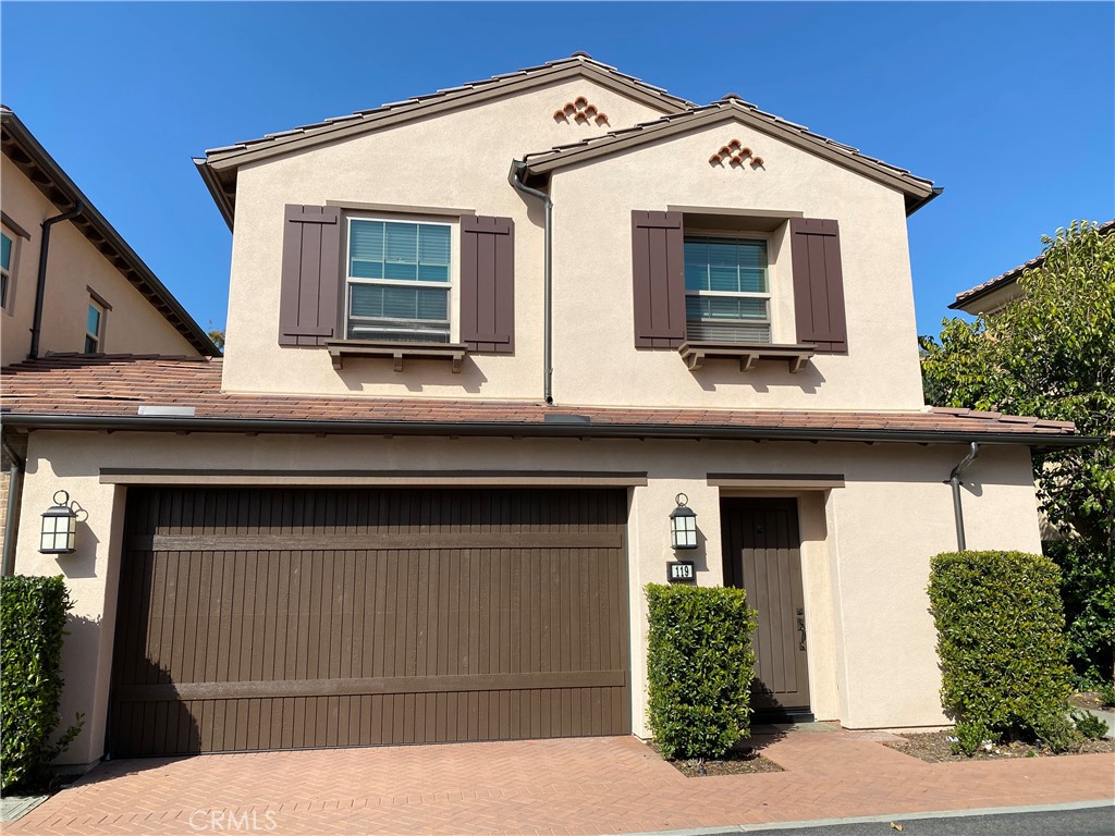 a view of a house with a window and garage