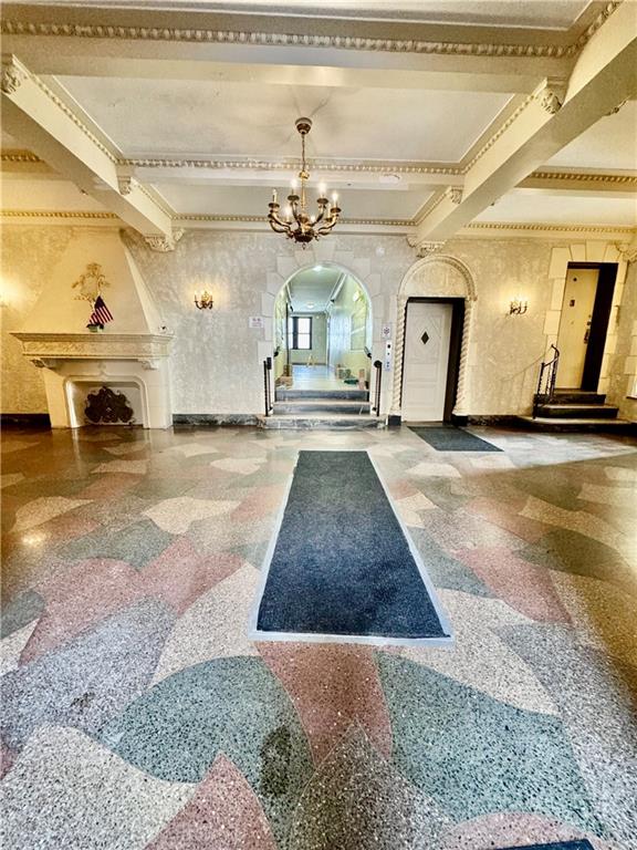 7501 Ridge Boulevard, Unit 2E Brooklyn, NY 11209 - Photo 3 of 13 a view of a livingroom with a fireplace and a chandelier