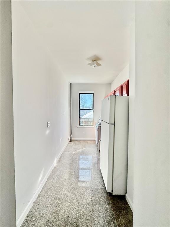7501 Ridge Boulevard, Unit 2E Brooklyn, NY 11209 - Photo 5 of 13 a view of a hallway with a white walls