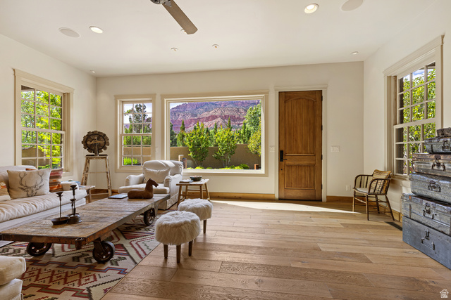 105 River Bend Circle, Unit 105 Springdale, UT 84767 - Photo 4 of 56 Spacious living area featuring wood-finish flooring, recessed lighting, and multiple large windows with natural wood trim