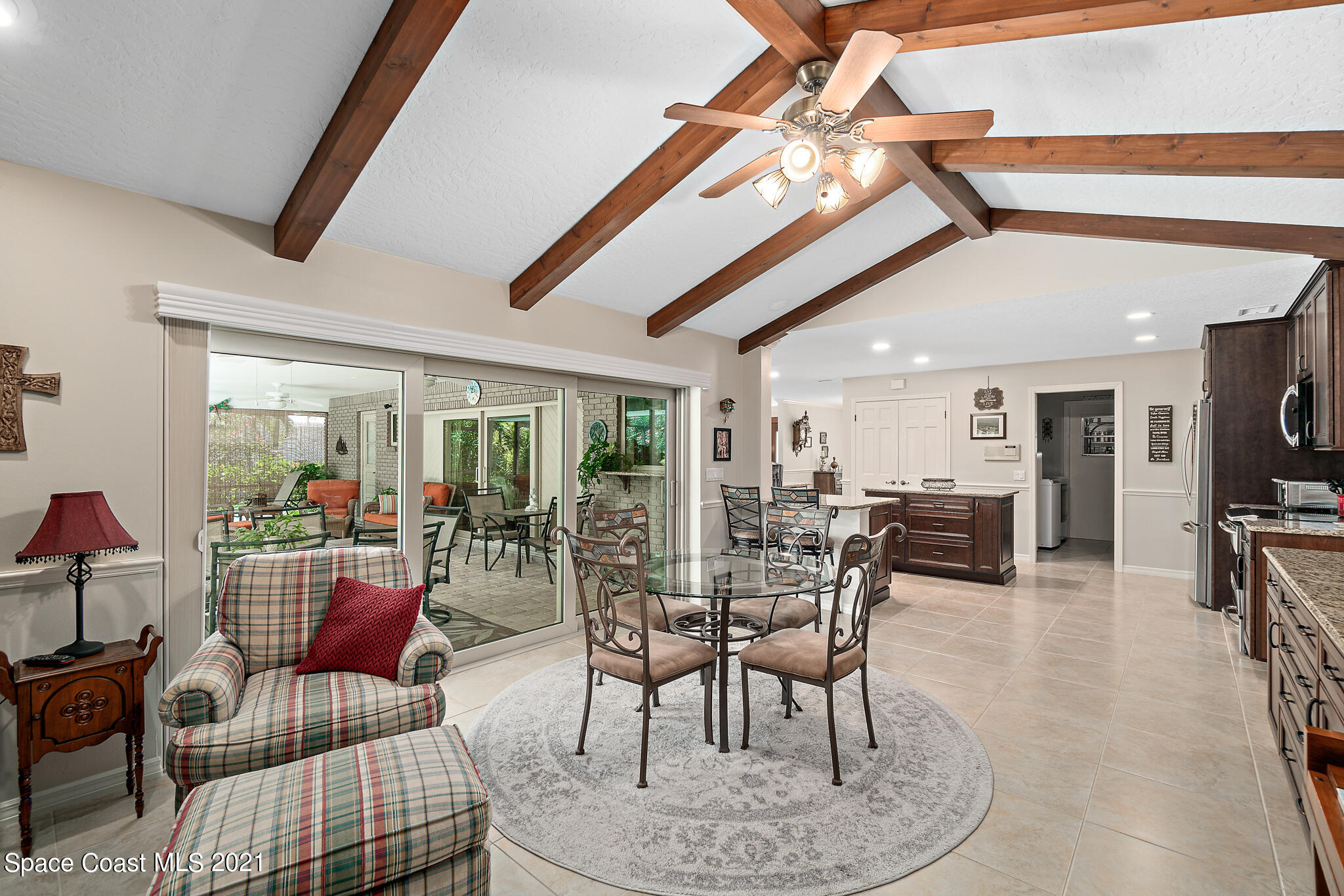 539 Lanternback Island Drive Satellite Beach, FL 32937 - Photo 17 of 54 a living room with furniture and a large window