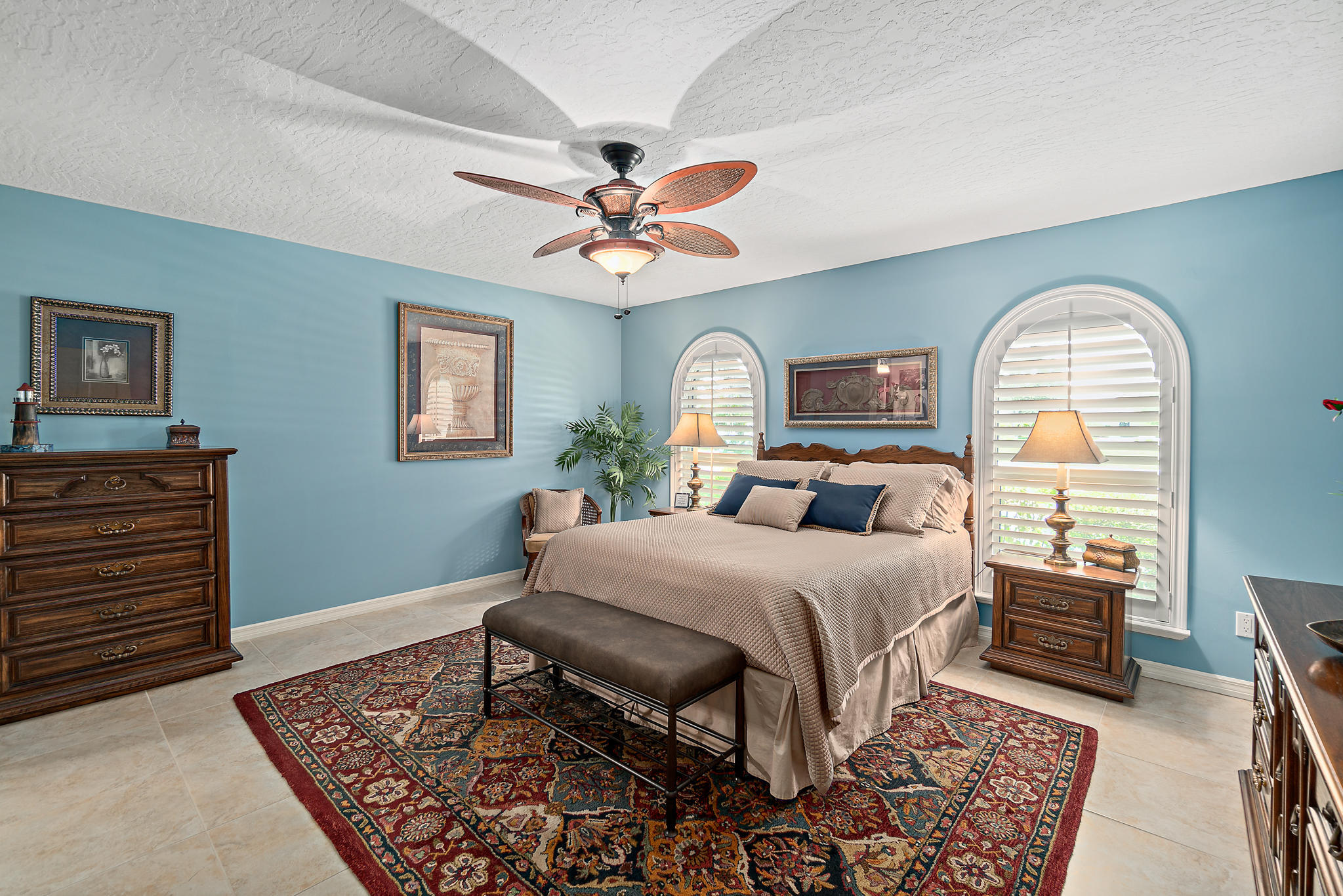 539 Lanternback Island Drive Satellite Beach, FL 32937 - Photo 18 of 54 a bed room with a bed and a chandelier