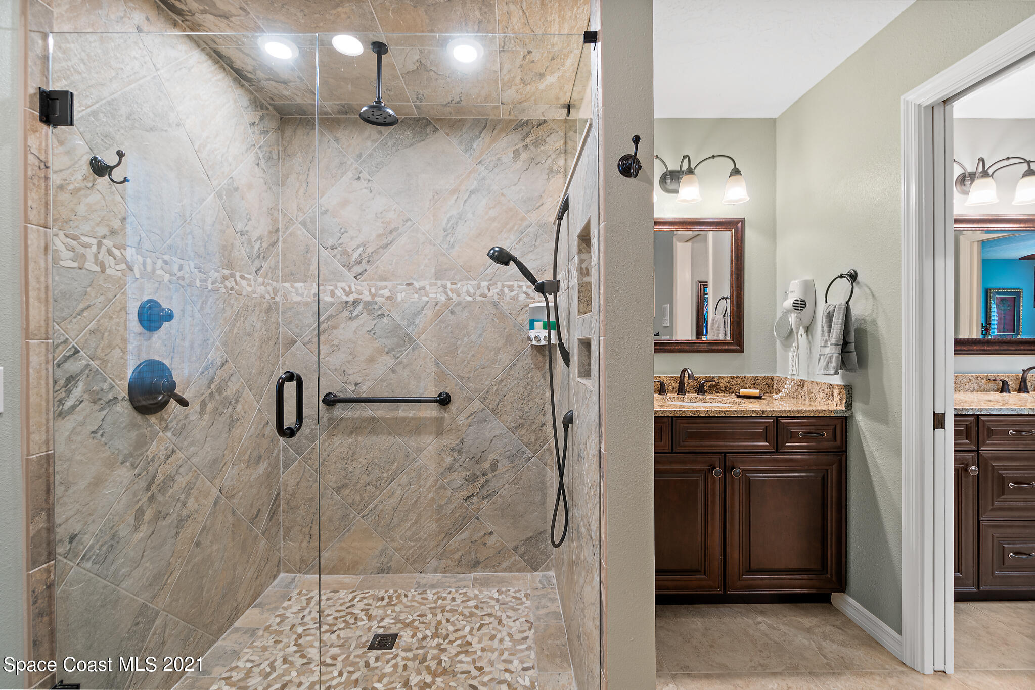 539 Lanternback Island Drive Satellite Beach, FL 32937 - Photo 23 of 54 a bathroom with a sink a toilet and shower