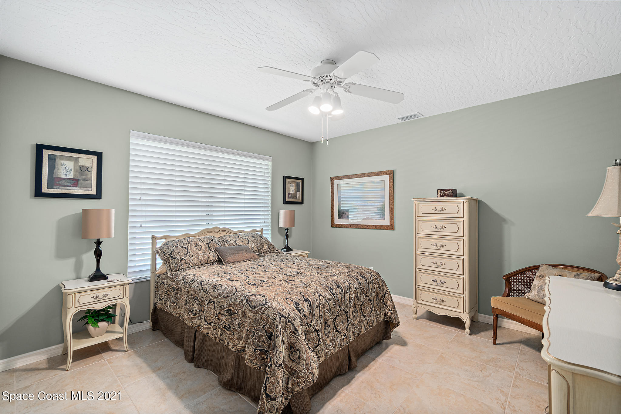 539 Lanternback Island Drive Satellite Beach, FL 32937 - Photo 30 of 54 a bedroom with a bed dresser and a window