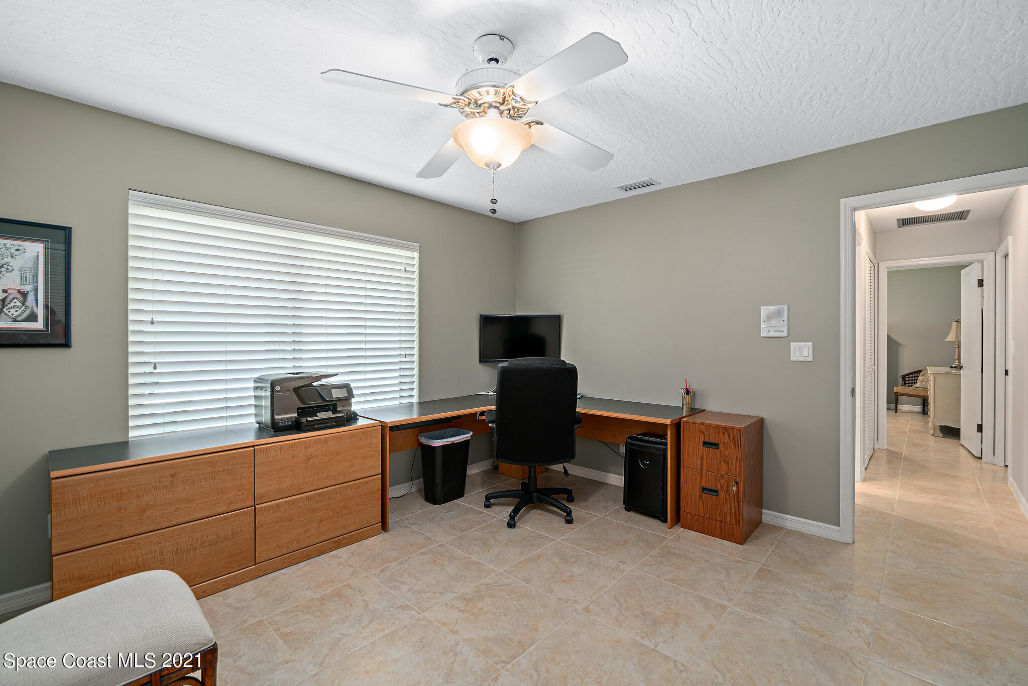 539 Lanternback Island Drive Satellite Beach, FL 32937 - Photo 34 of 54 a view of a workspace with furniture and a window