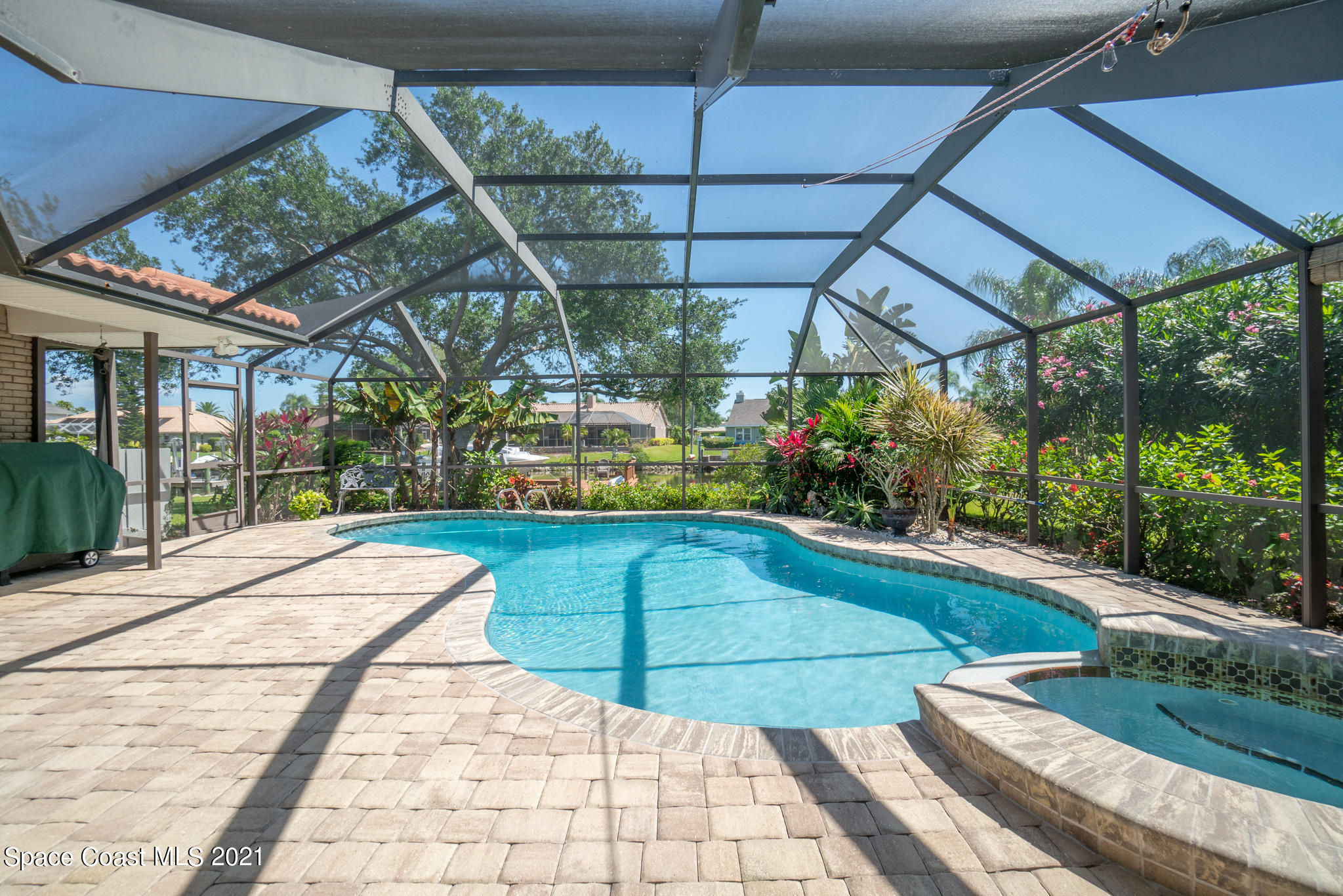 539 Lanternback Island Drive Satellite Beach, FL 32937 - Photo 37 of 54 a view of a swimming pool with a patio
