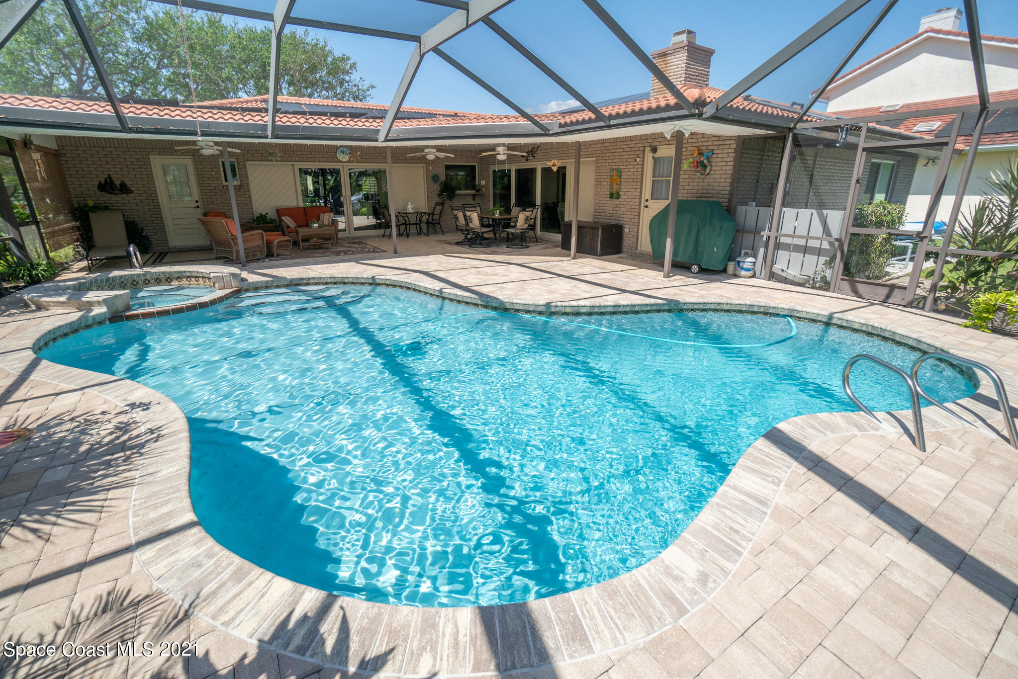 539 Lanternback Island Drive Satellite Beach, FL 32937 - Photo 40 of 54 a view of a house with backyard porch and sitting area