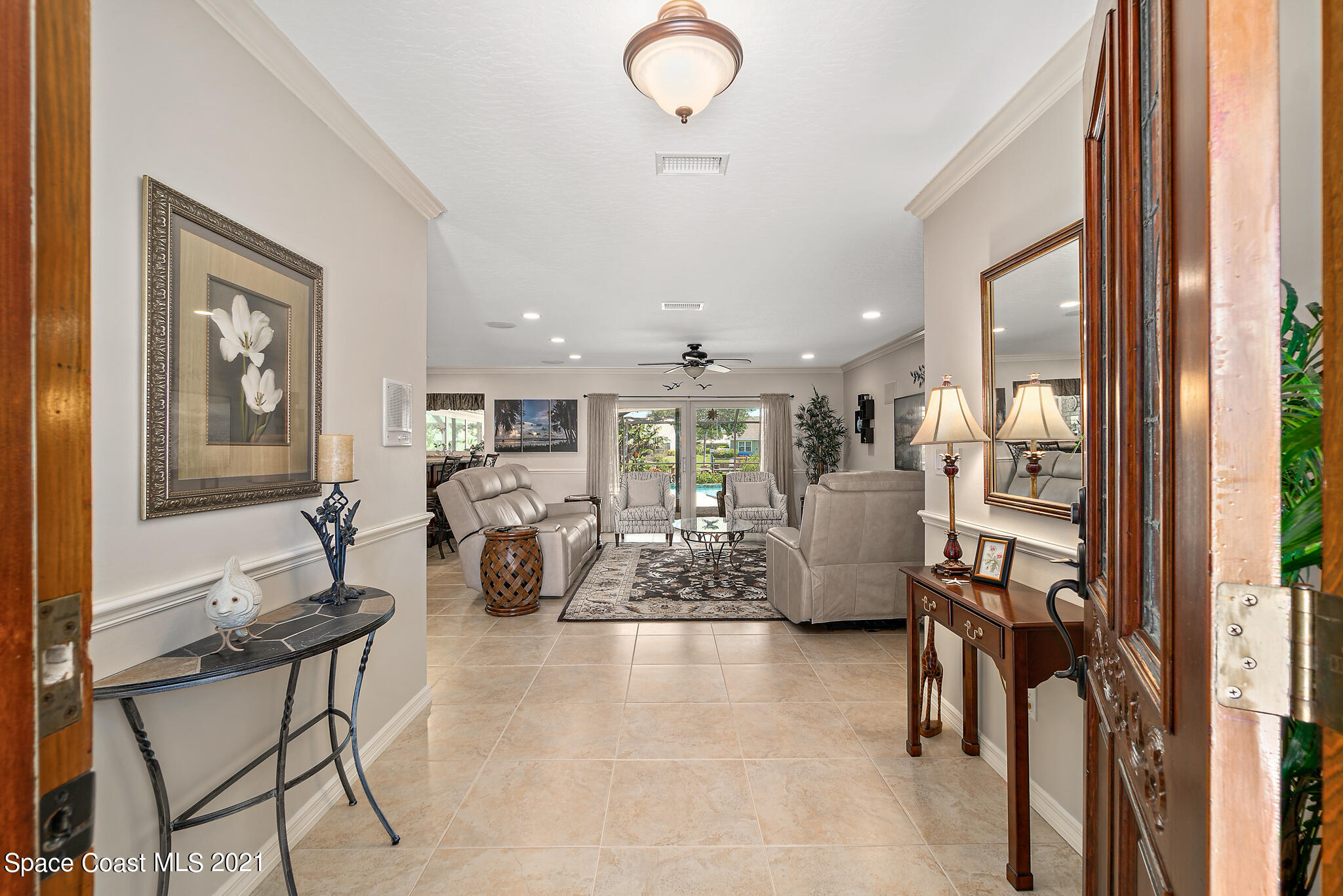 539 Lanternback Island Drive Satellite Beach, FL 32937 - Photo 5 of 54 a view of a livingroom with furniture and windows