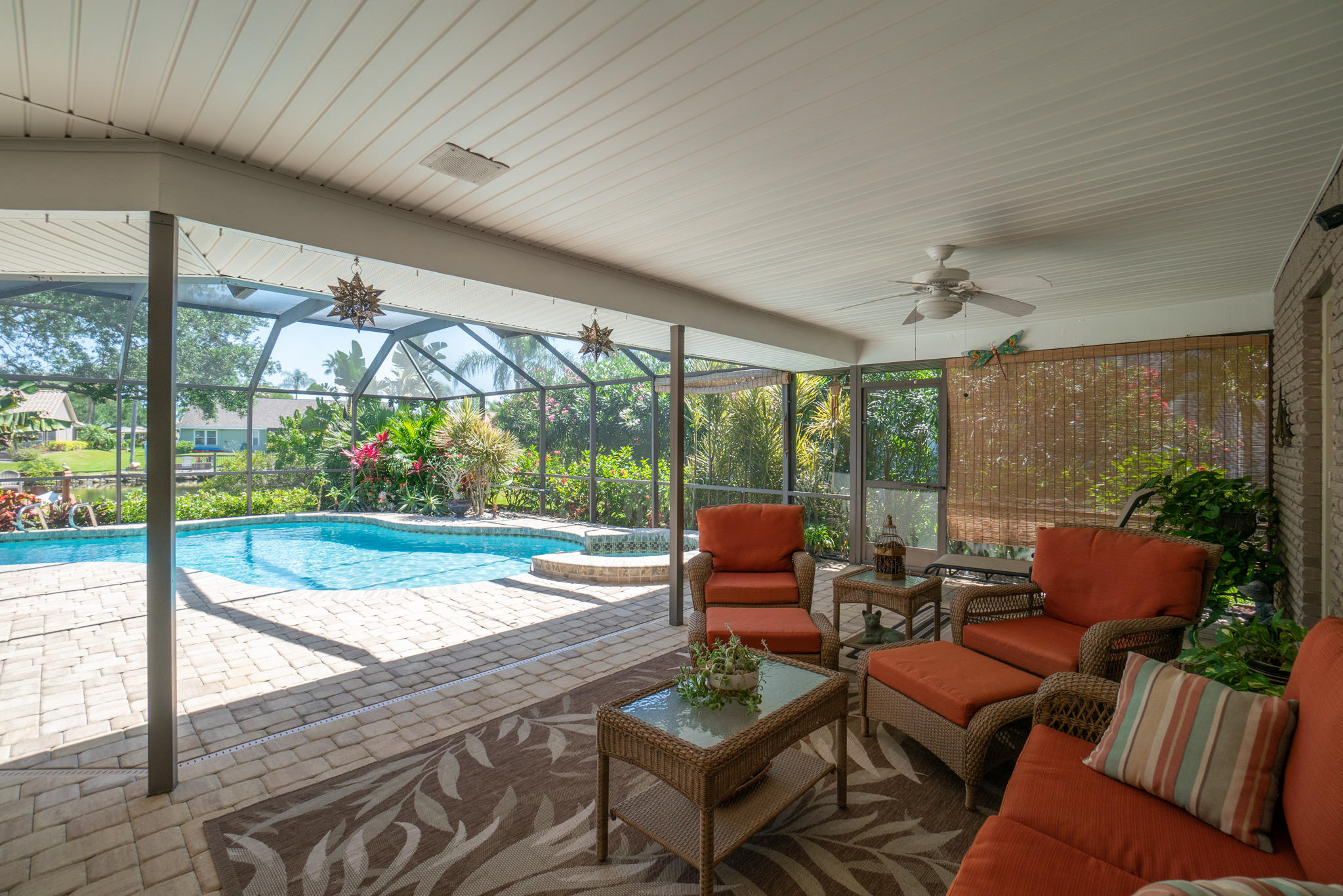 539 Lanternback Island Drive Satellite Beach, FL 32937 - Photo 41 of 54 a patio with yard glass top table and chairs
