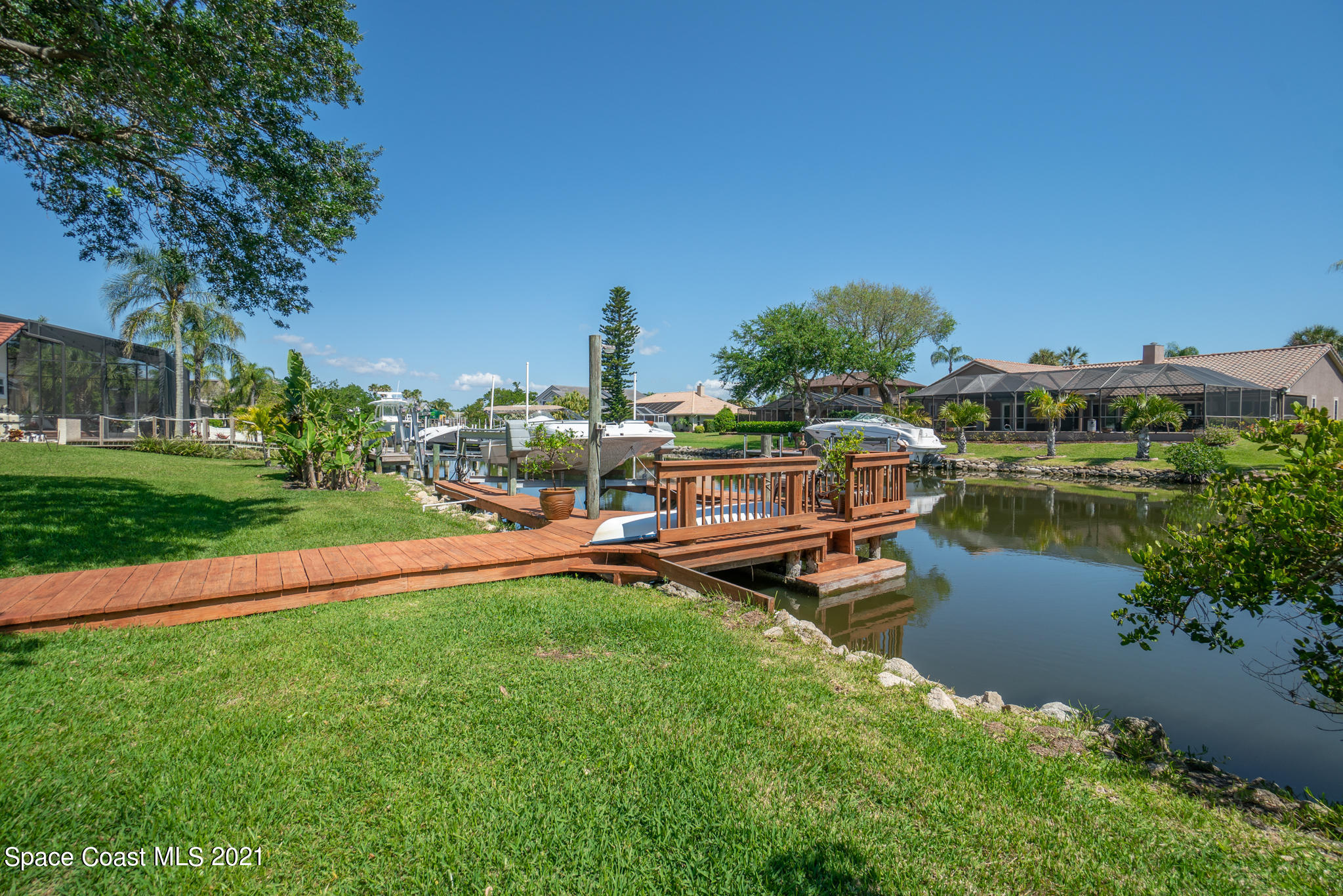 539 Lanternback Island Drive Satellite Beach, FL 32937 - Photo 46 of 54 a view of a lake with houses in the back