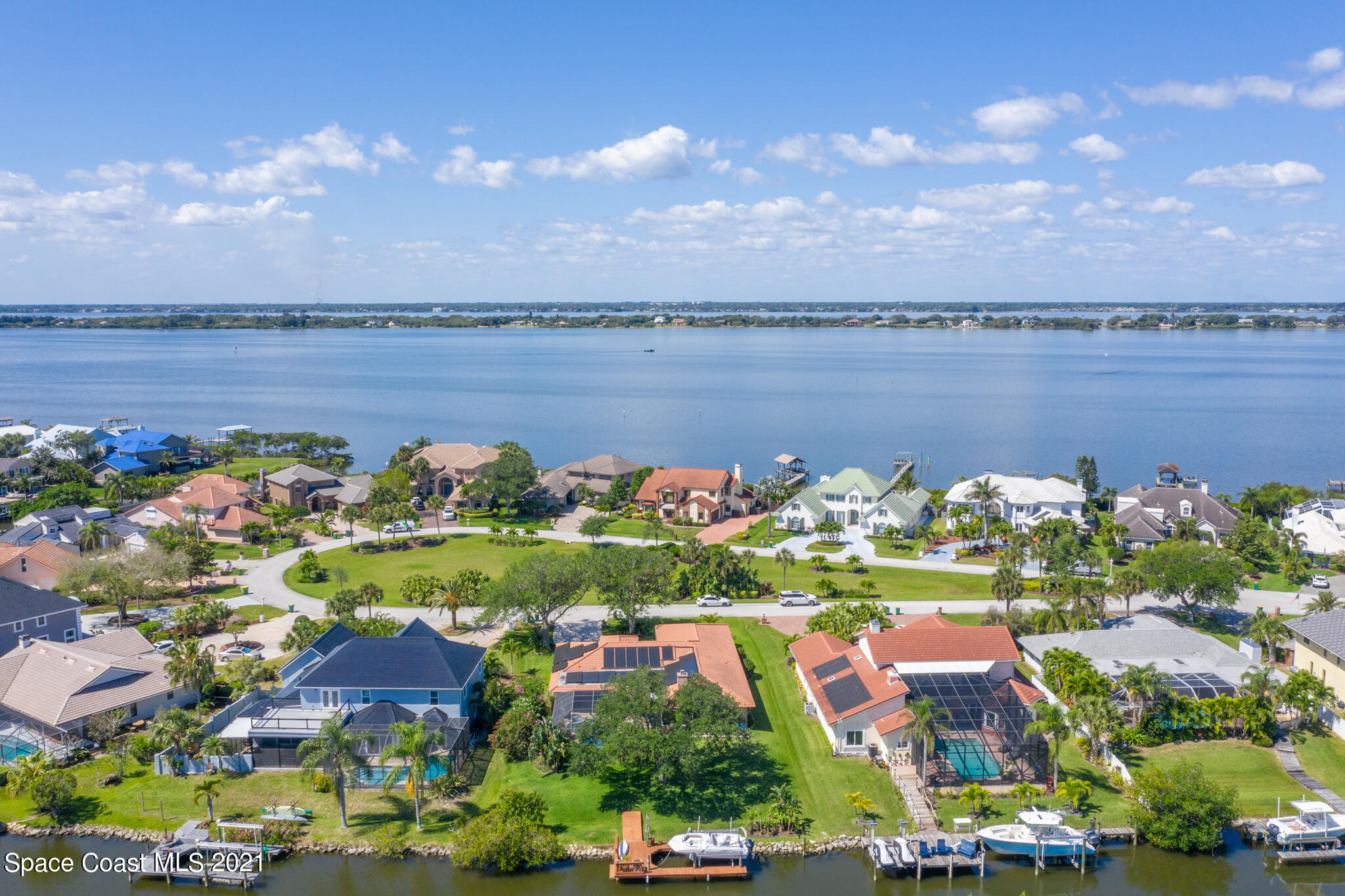 539 Lanternback Island Drive Satellite Beach, FL 32937 - Photo 49 of 54 a view of a lake with a city