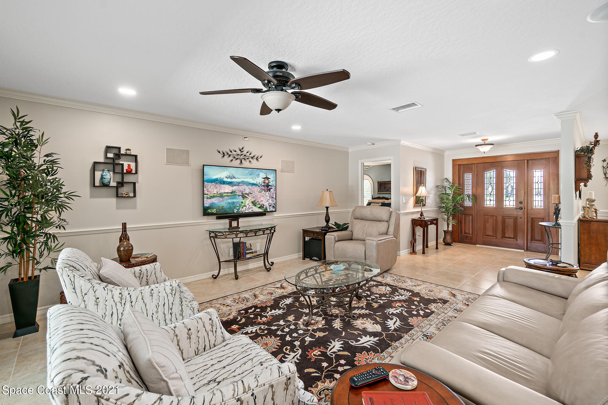539 Lanternback Island Drive Satellite Beach, FL 32937 - Photo 6 of 54 a living room with furniture and a large window