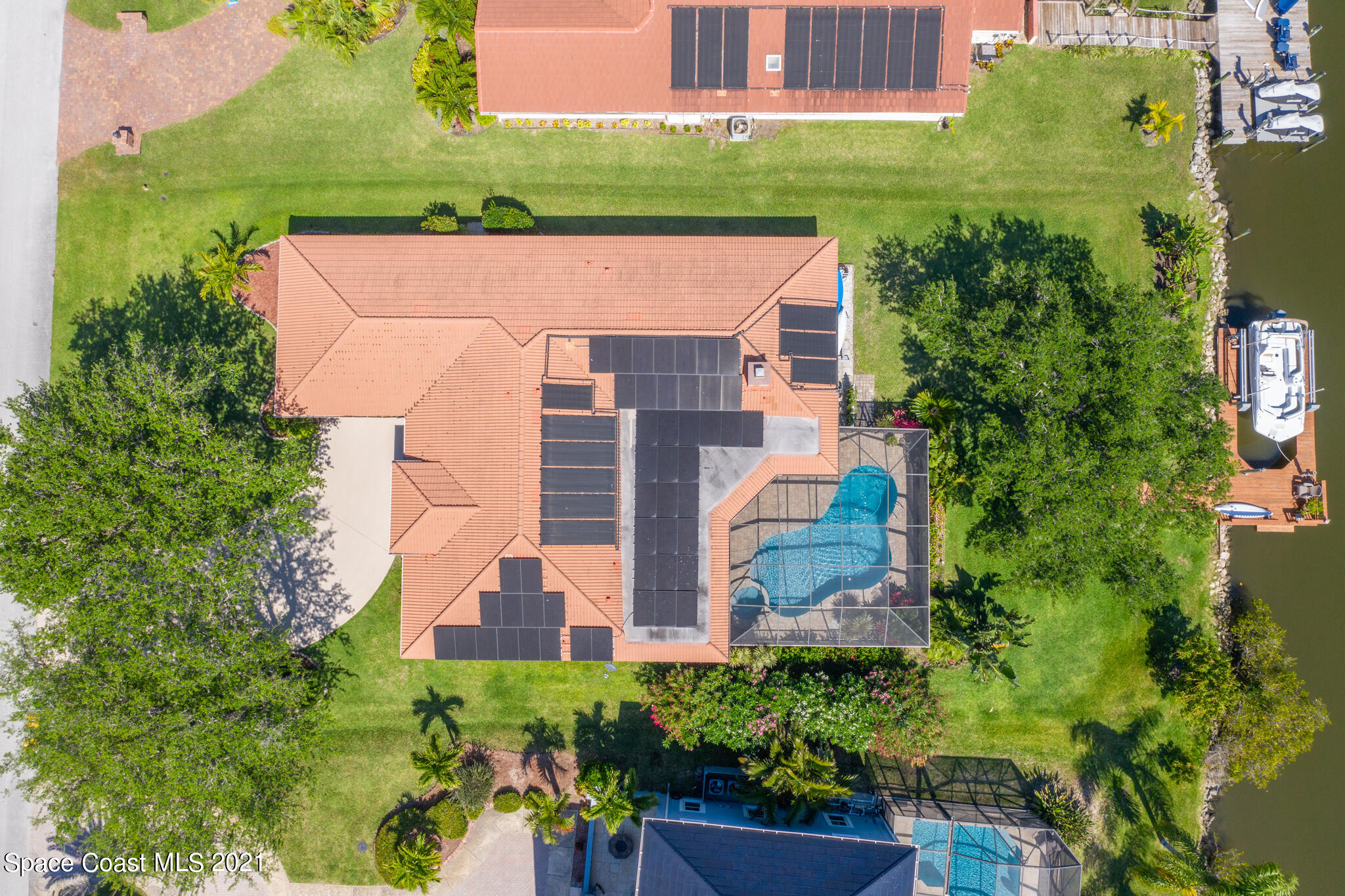 539 Lanternback Island Drive Satellite Beach, FL 32937 - Photo 54 of 54 an aerial view of a house with a garden